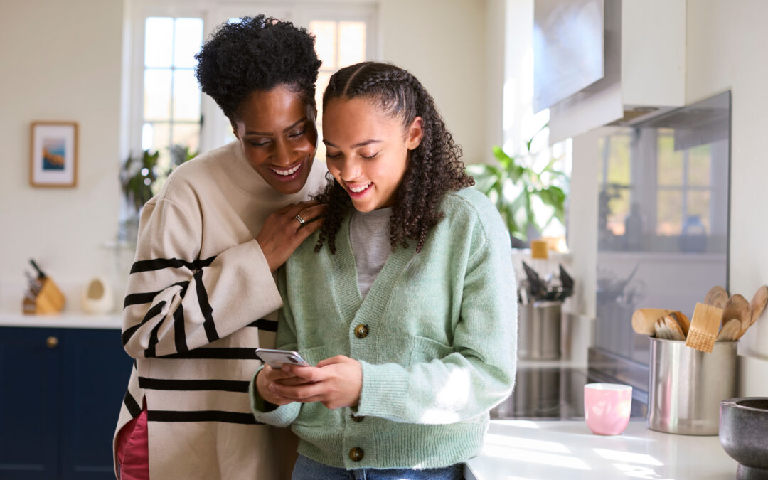 A parent looks at the Pyx Health app with her teen daughter.